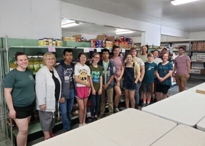 Youth helping at SNM Food Bank 2022